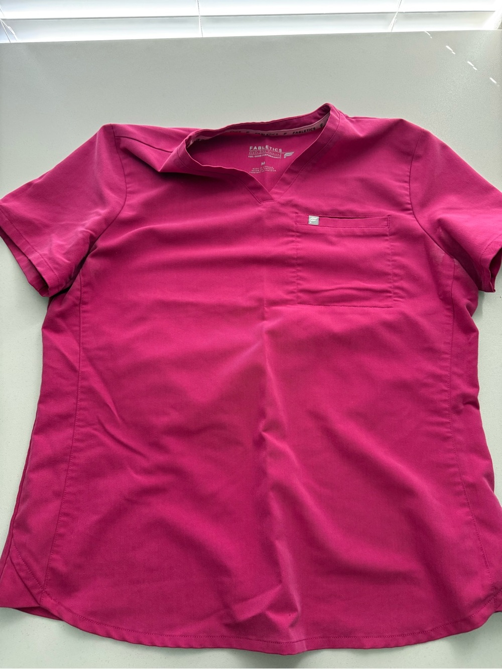 Fabletics pink one pocket scrub top
